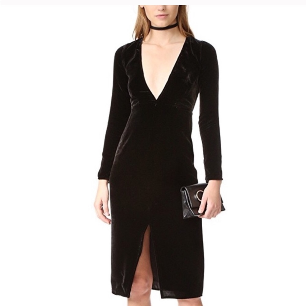 Black fitted velvet midi dress with deep Vneckline